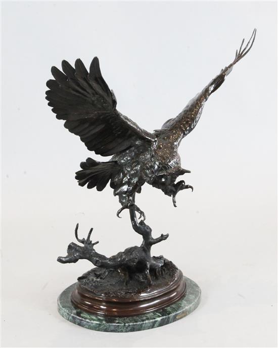After Jules Moigniez (1835-1894), a bronze sculpture of an owl alighting on a branch, height 30ins, width 27ins
